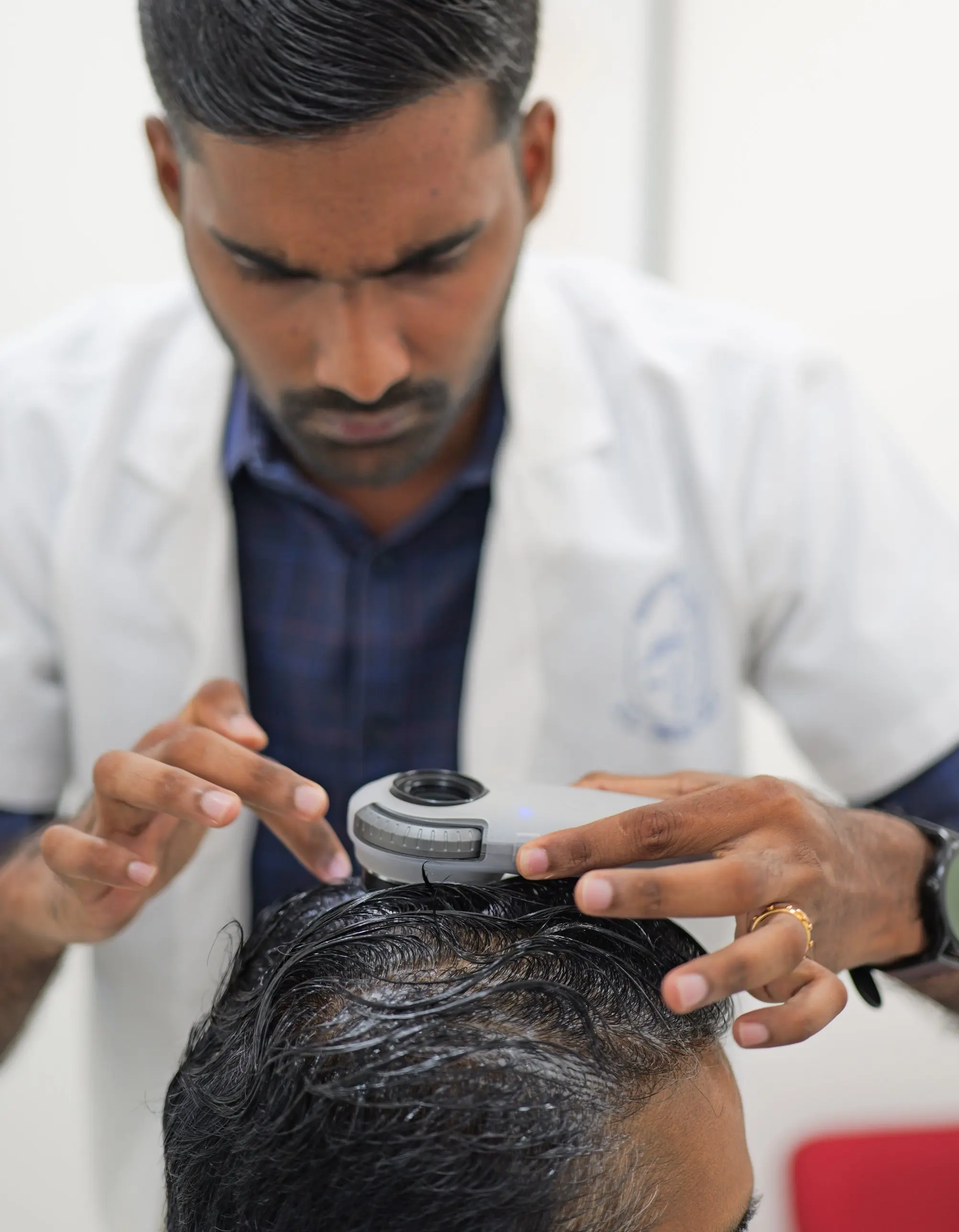 Doctor explaining GLP-1 side effects including hair fall and skin changes to a patient at DermaVue