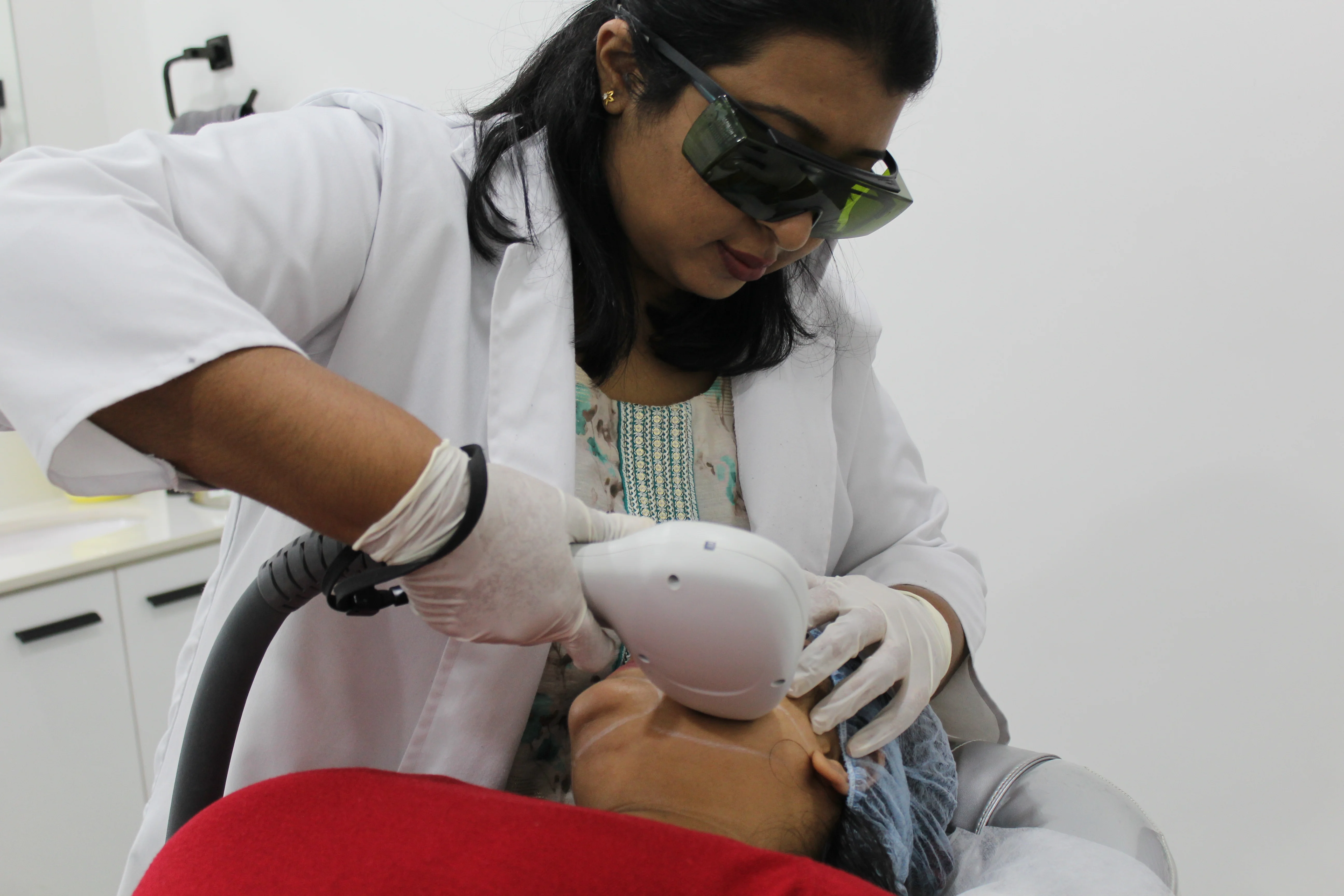 Dermatologist performing laser hair removal treatment at DermaVue Thrissur clinic in Punkunnam