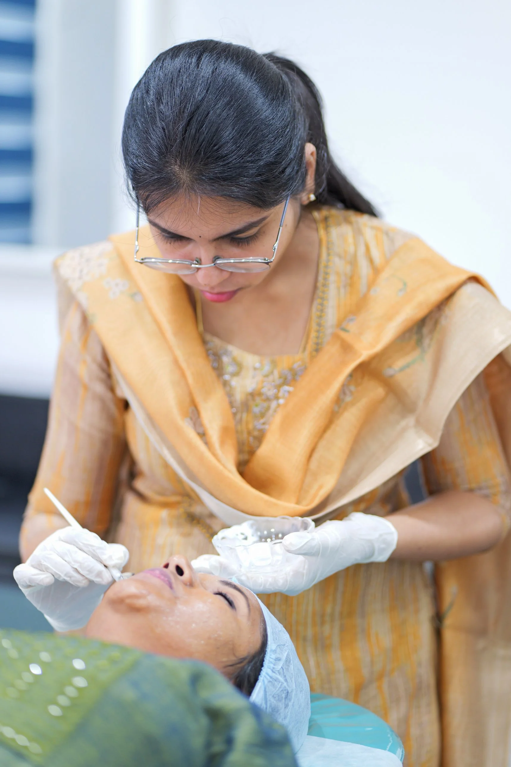 Dermatologist at DermaVue clinic discussing niacinamide skincare routine with a patient during a consultation
