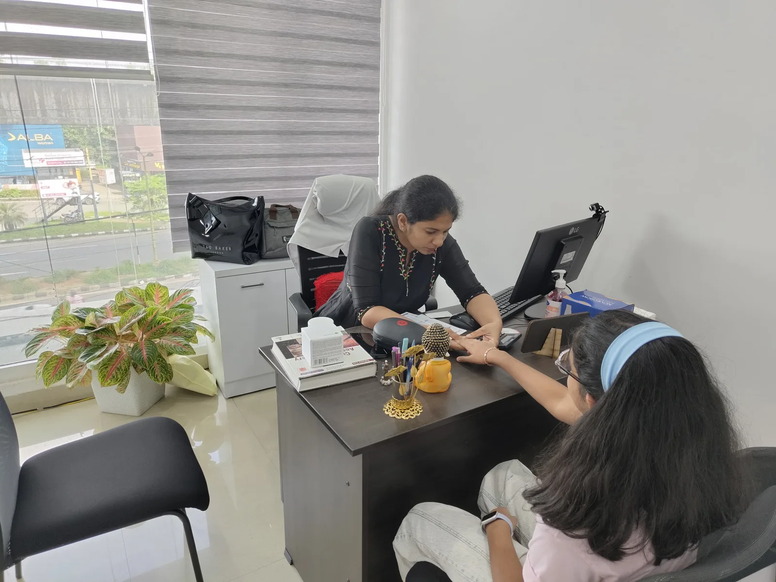 Dermatologist examining a child's skin at DermaVue Kollam clinic
