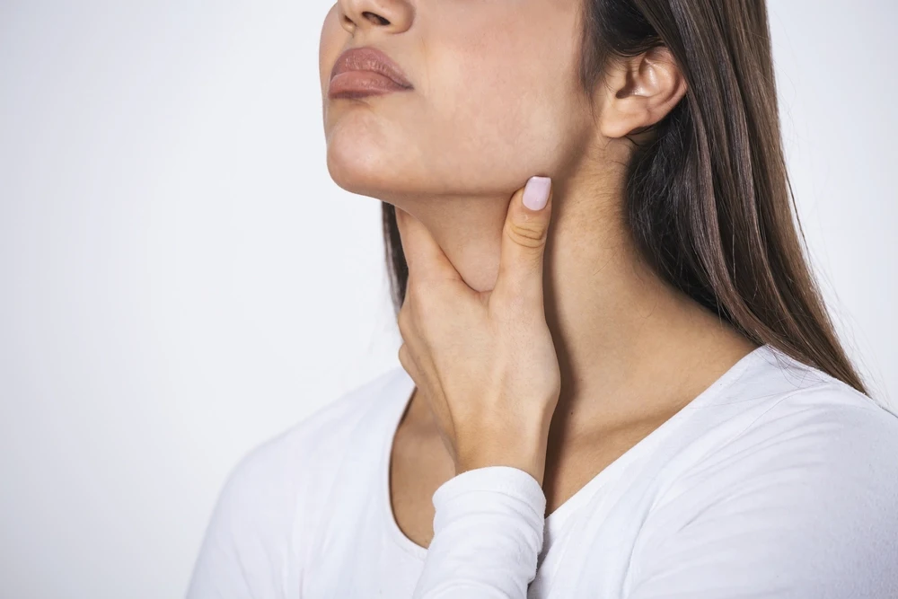 Woman undergoing double chin reduction treatment at DermaVue