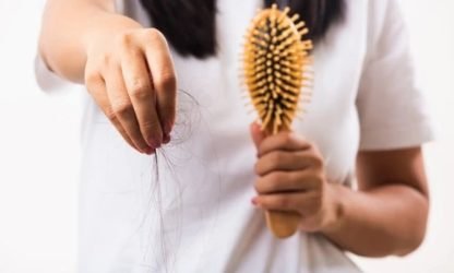 Woman with hair loss concerns receiving treatment at skin care clinic - Kerala.