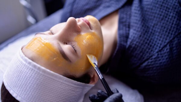 A young woman does a cosmetic procedure at a beauty center or cl