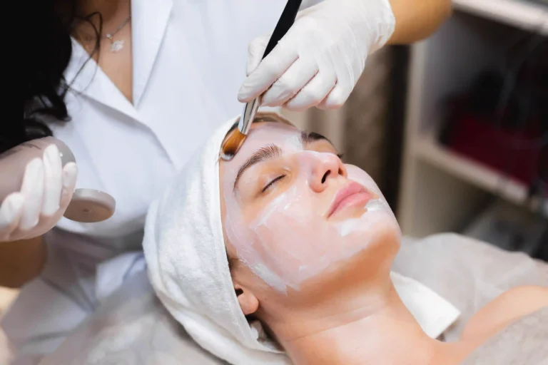 Woman undergoing skin peel treatment at a dermatology clinic